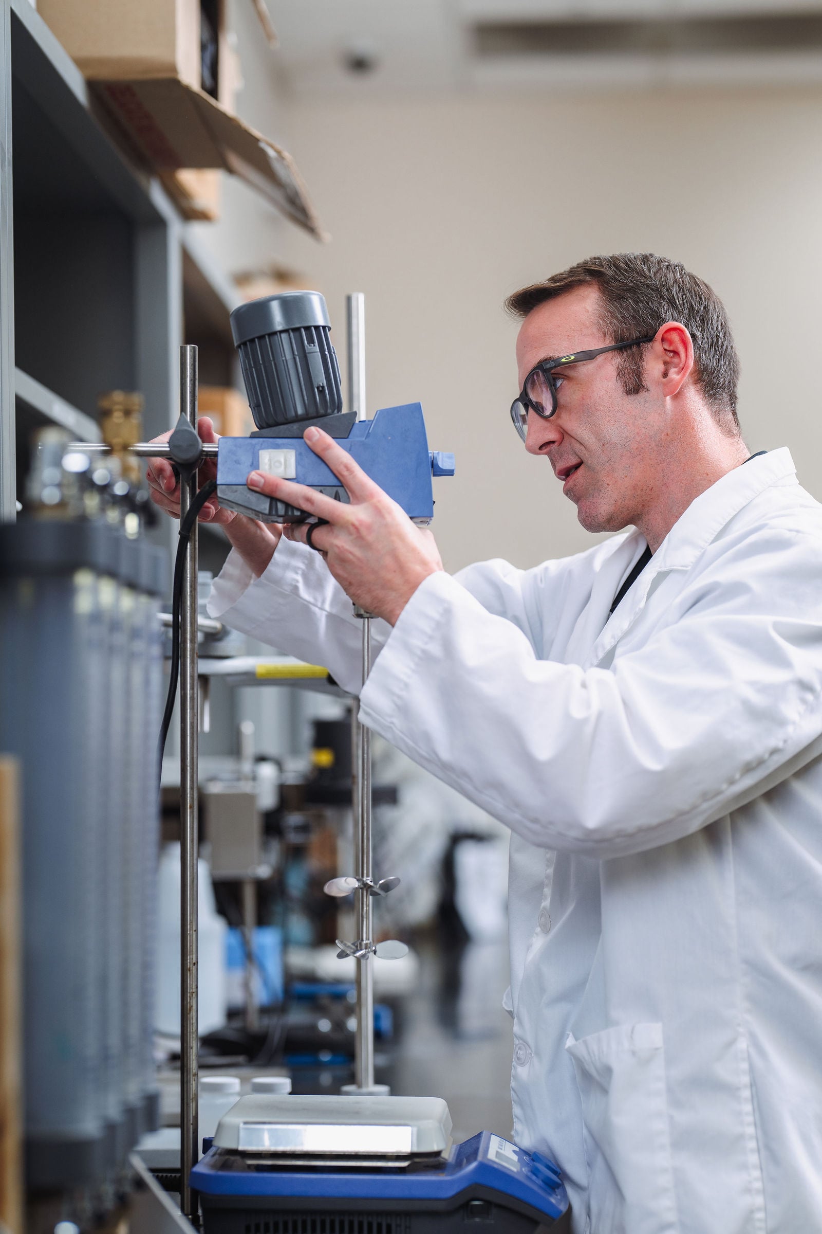 Scientist operating laboratory equipment