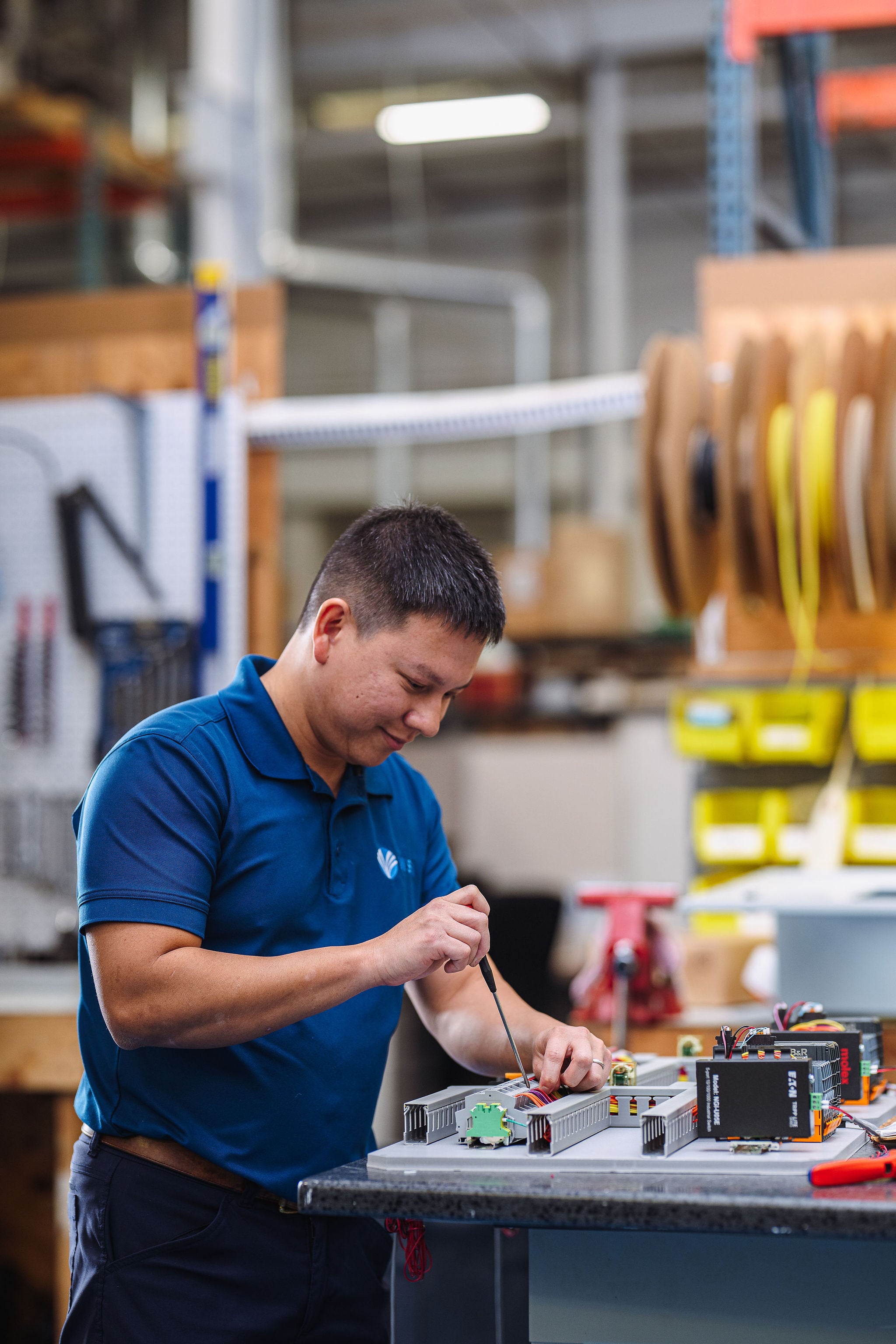 WSI technician assembling electronic components