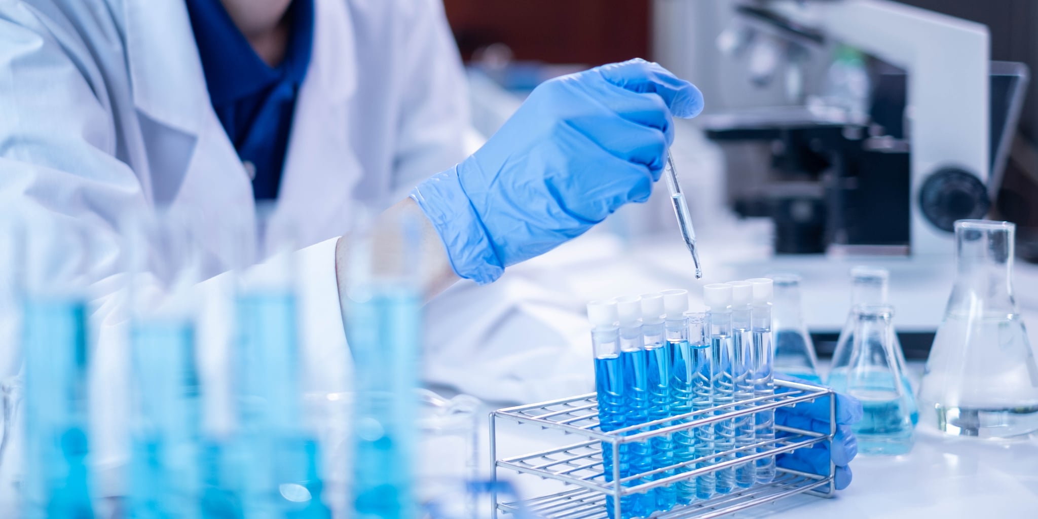 Laboratory technician handling scientific equipment with TRUpath technology