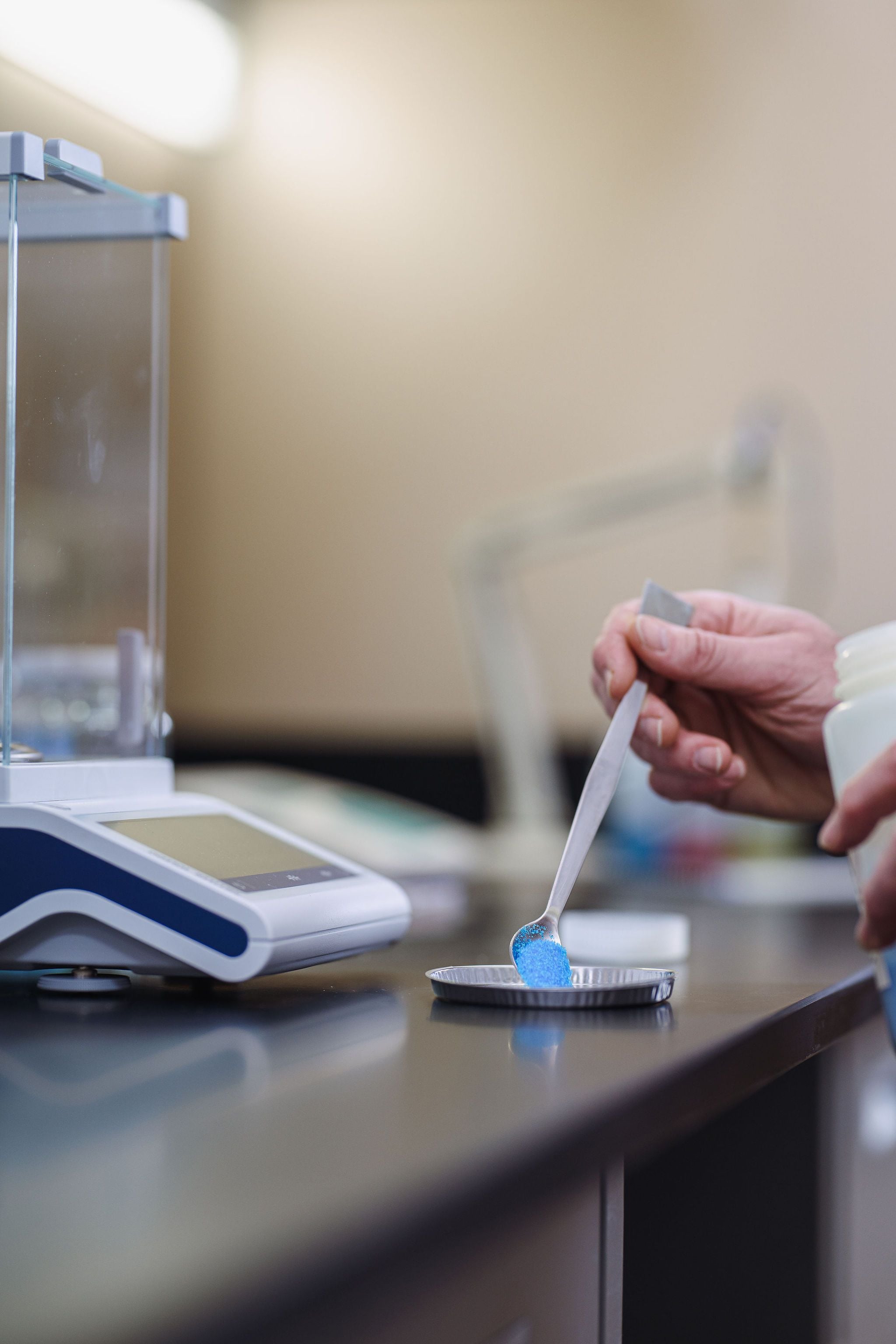 Blue powder on precision scale