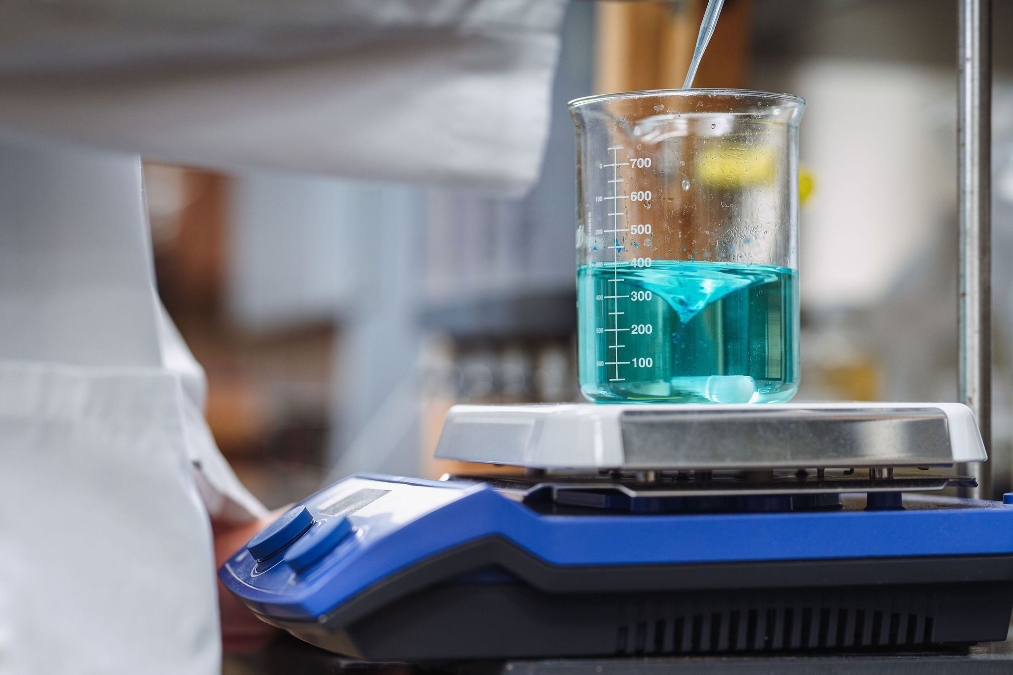 Chemistry beaker with blue-green liquid