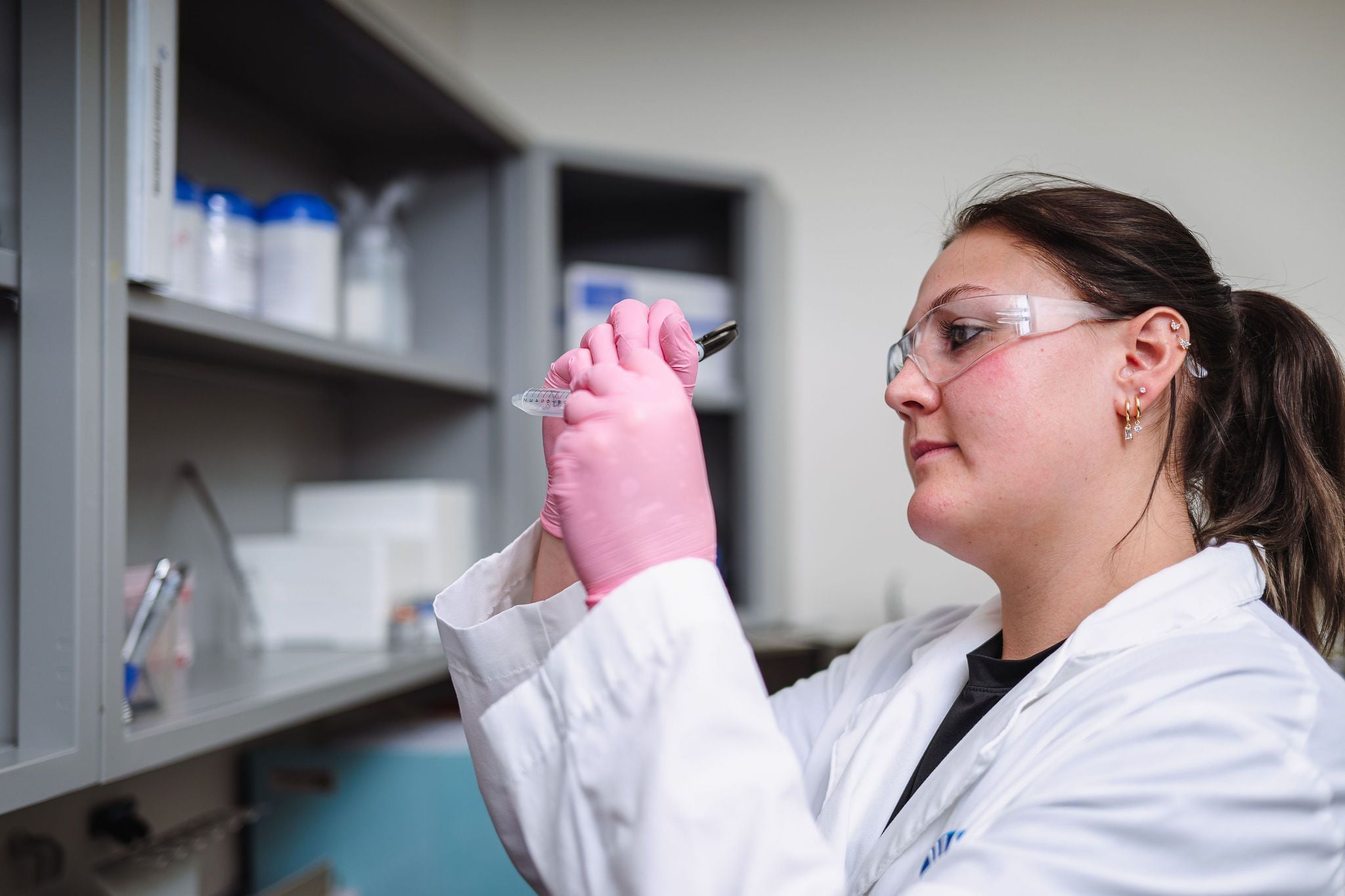 WSI scientist examining sample